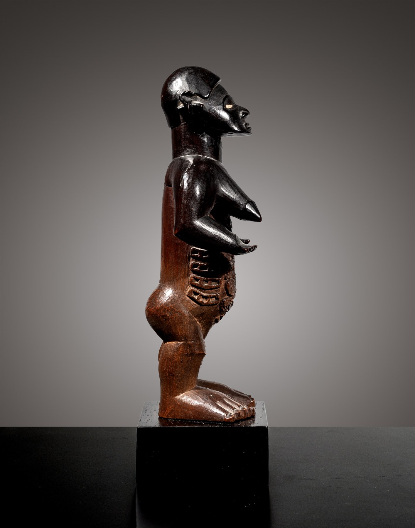 Bembe female ancestor figure – profile view Bembe female ancestor figure, D.R. Congo, late 19th–early 20th century, wood and porcelain, profile view